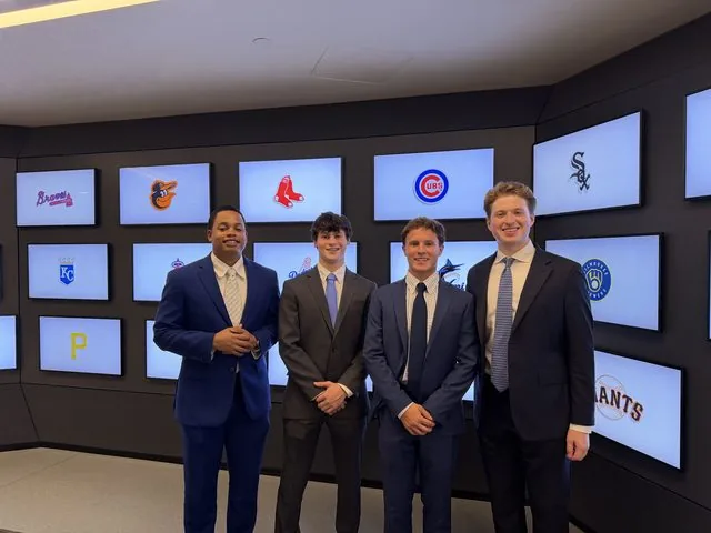 Colin Hofmeister with colleagues in the MLB office